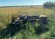 FOTO  Buldoexcavator răsturnat pe drumurile din Tulcea. Doi răniți
